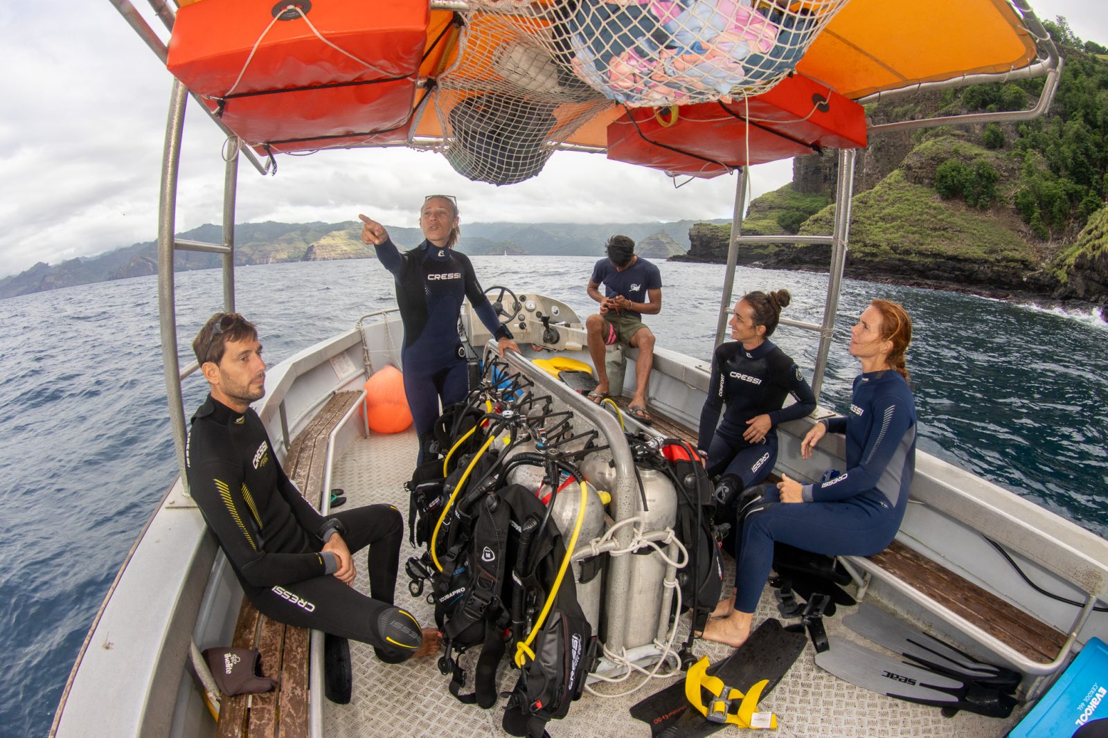 Instructor briefing divers on board the boat